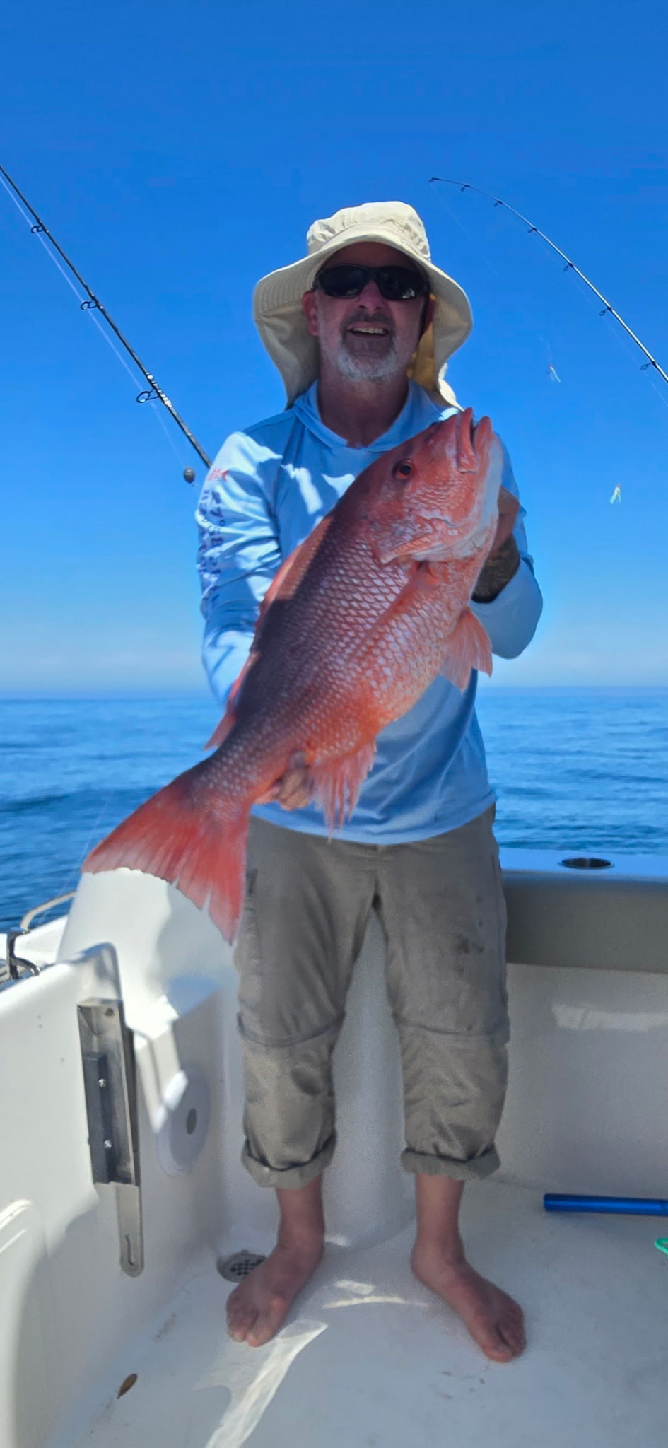 Happy angler with big red snapper catch